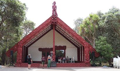 People standing in front of a marae.