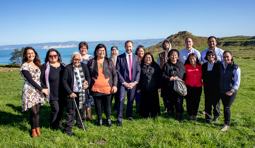 Whānau standing on the whenua with Minister Mahuta and Minister Little.
