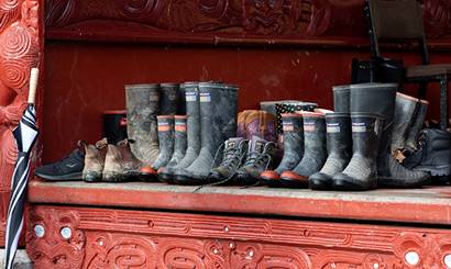 A row of gumboots at the marae.